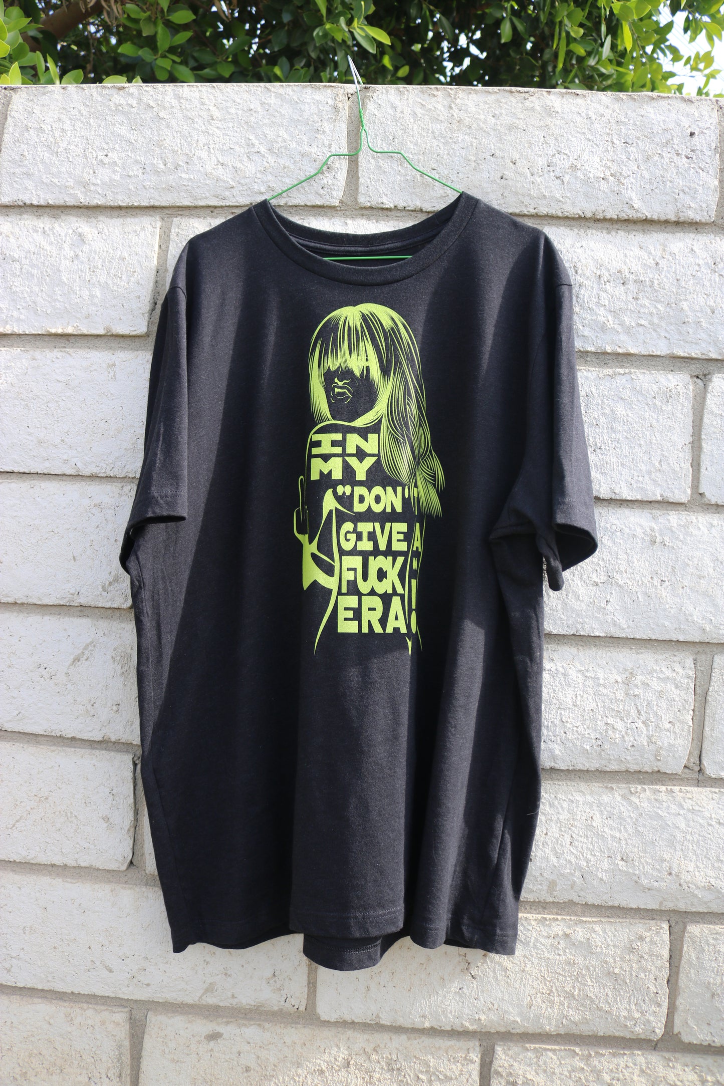 "In My Don't Give a Fuck Era" Unisex t-shirt in Black Heather with lime green print